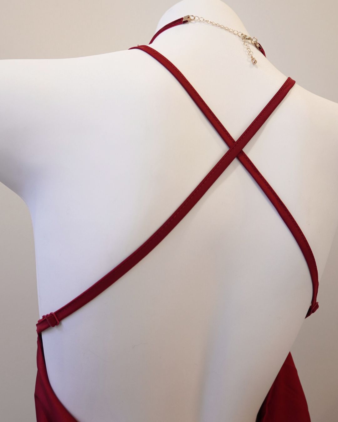 Red strappy top on a mannequin against a neutral background by fairyberry
