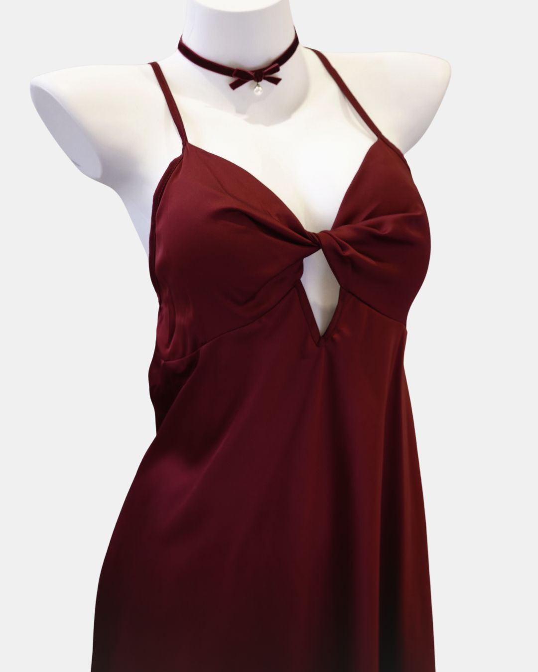 Maroon red nightdress on a mannequin with a white background