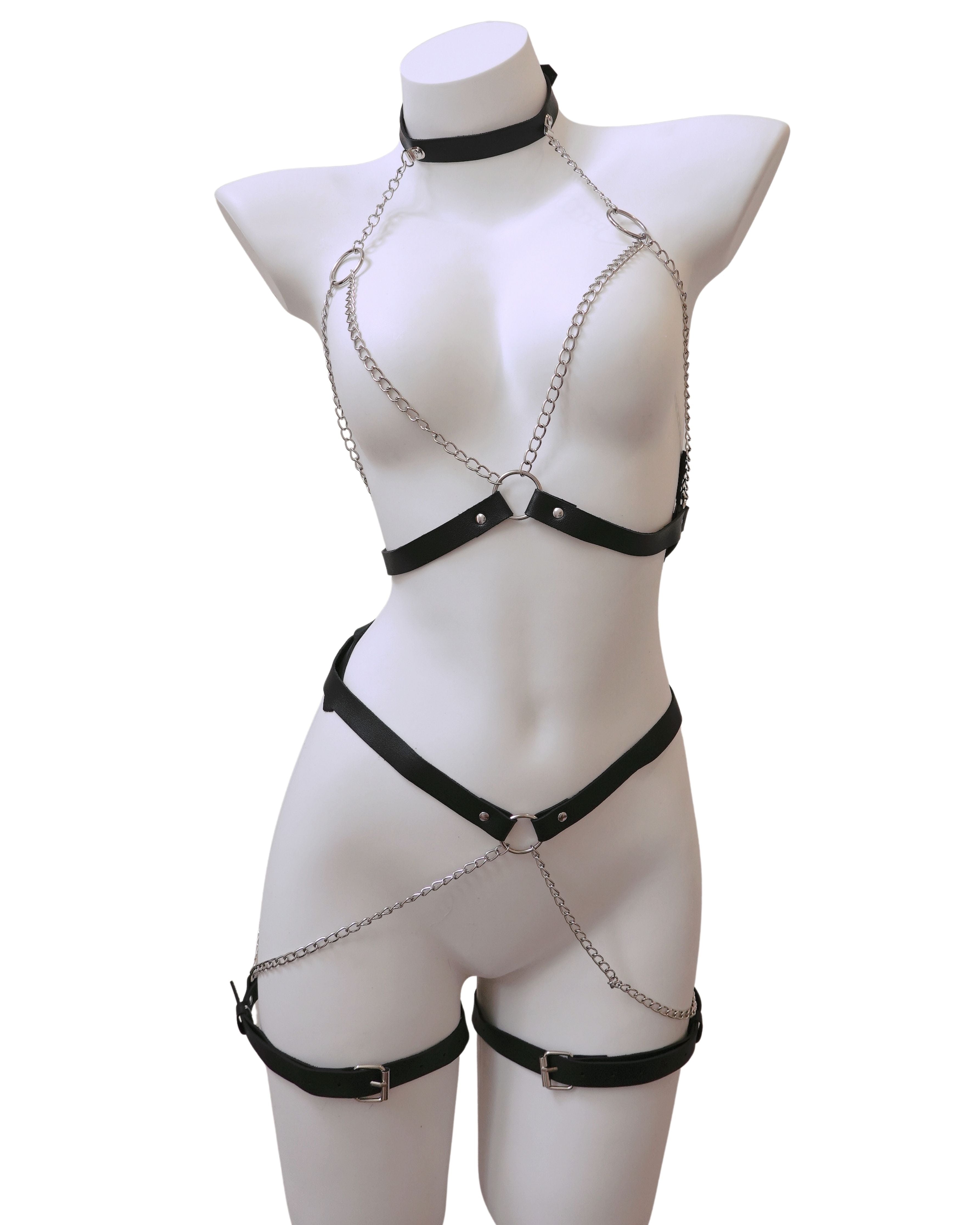 Black chain harness on a mannequin against a white background