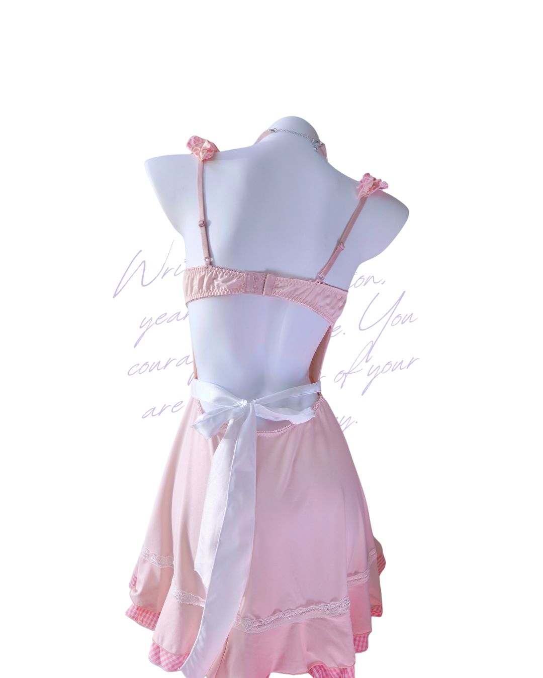Pink lace sugarmaid dress on a mannequin with a white background