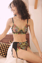 Model wearing FairyBerry Floravela embroidered lingerie set with sheer black mesh, multicolor floral bra, and matching garter belt – front view