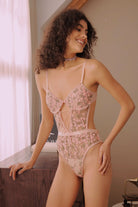 Romantic pink floral teddy with sheer high-cut leg design and embroidery over nude mesh