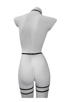 Back view of black strappy lingerie harness showing adjustable elastic fit and clean lines – soft bondage look