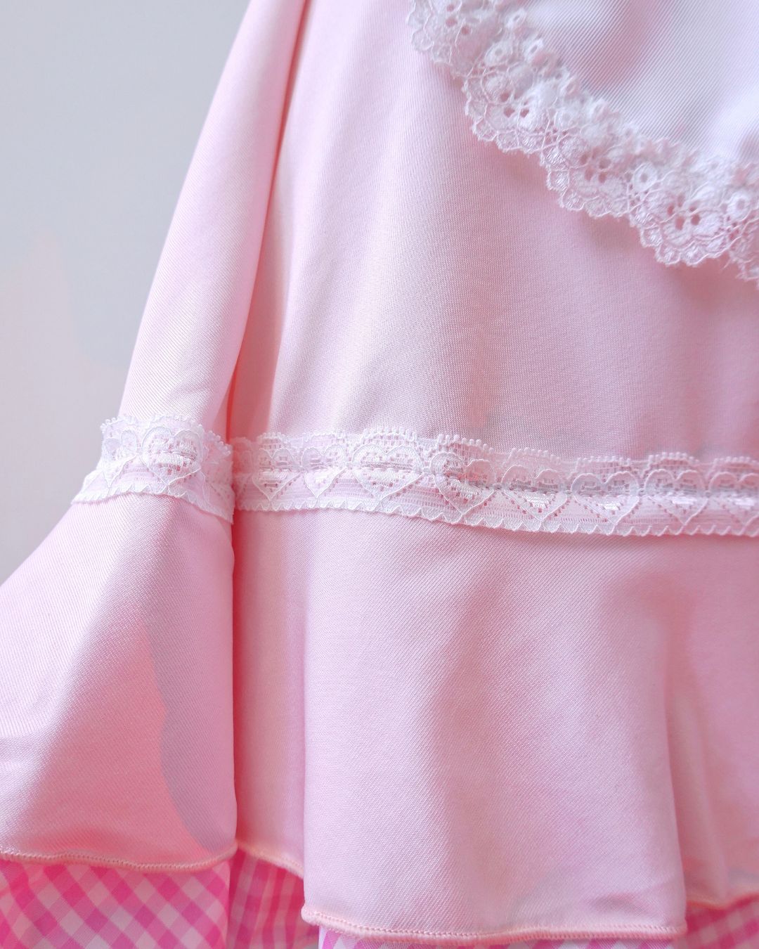 Delicate lace and satin details of Blush Sugarmaid maid outfit, feminine pink lingerie style