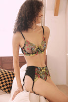 Black lace lingerie set with colorful floral embroidery – bold and romantic design