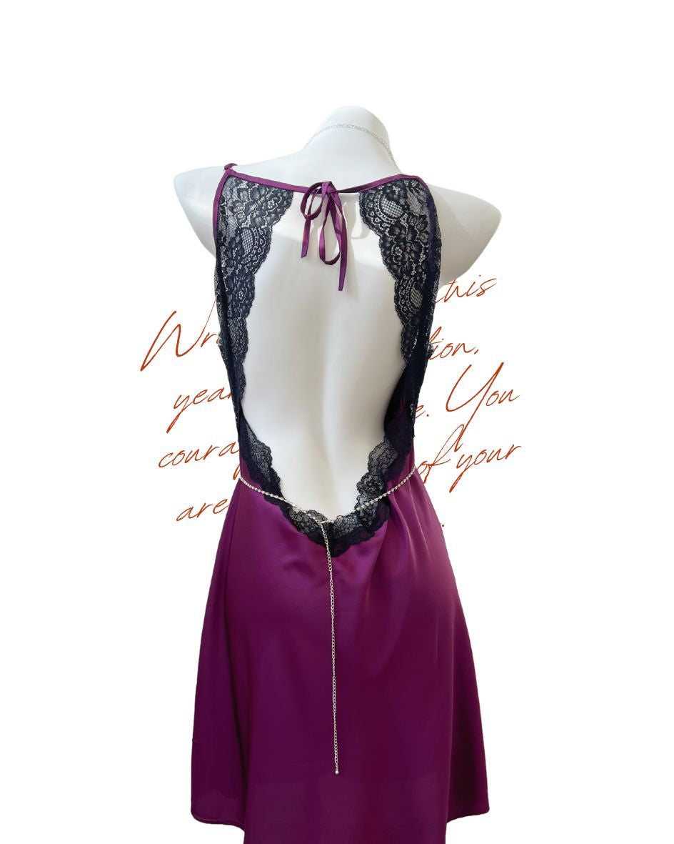 Purple satin nightgown with black lace details on a mannequin against a white background.