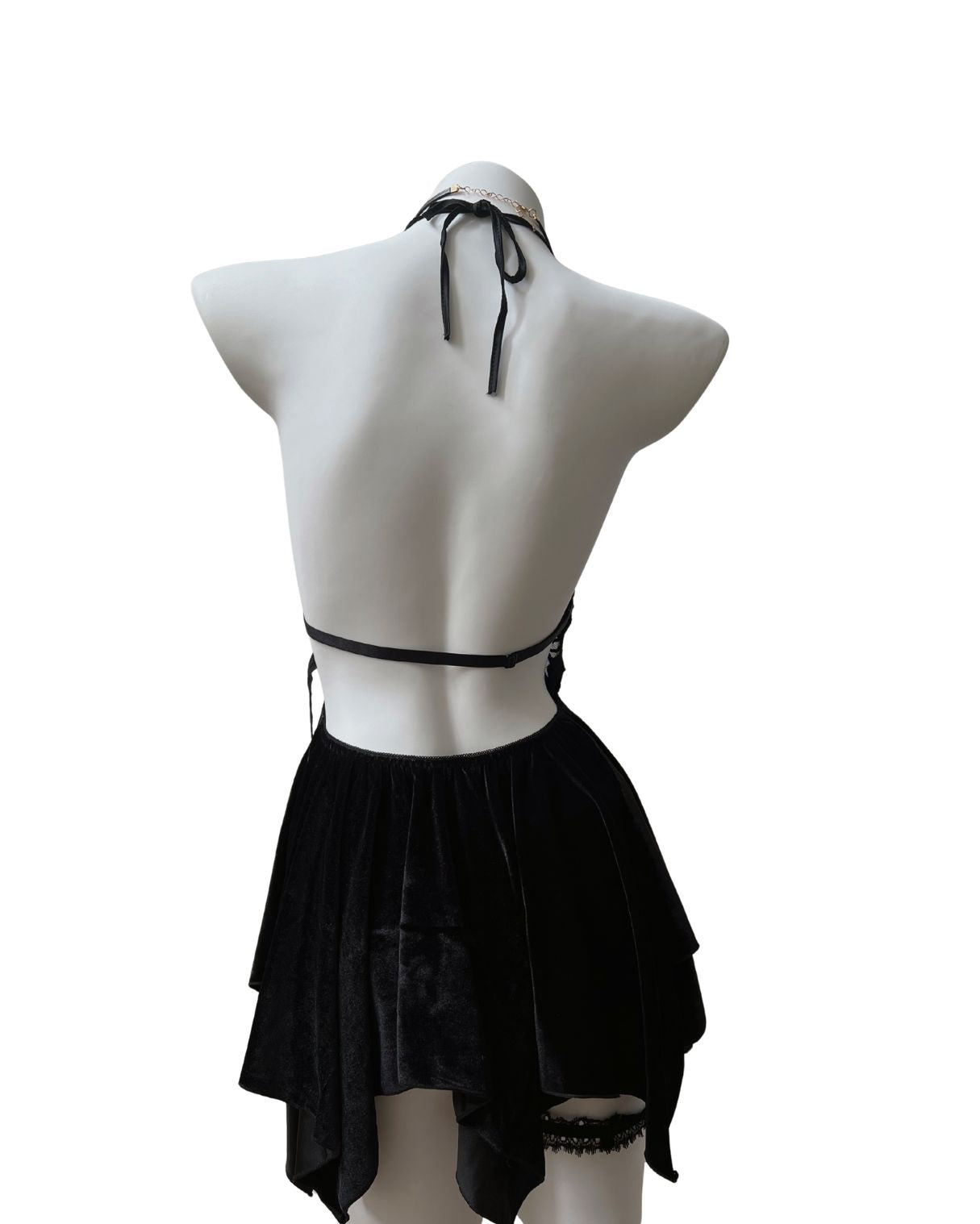 Black velvet mini dress on a mannequin against a white background