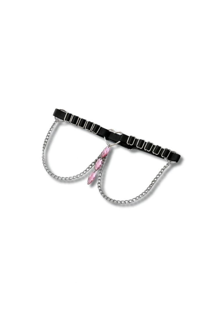 Black leg harness with chain and pink clip on a white background
