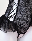 Black lace lingerie set on a white background