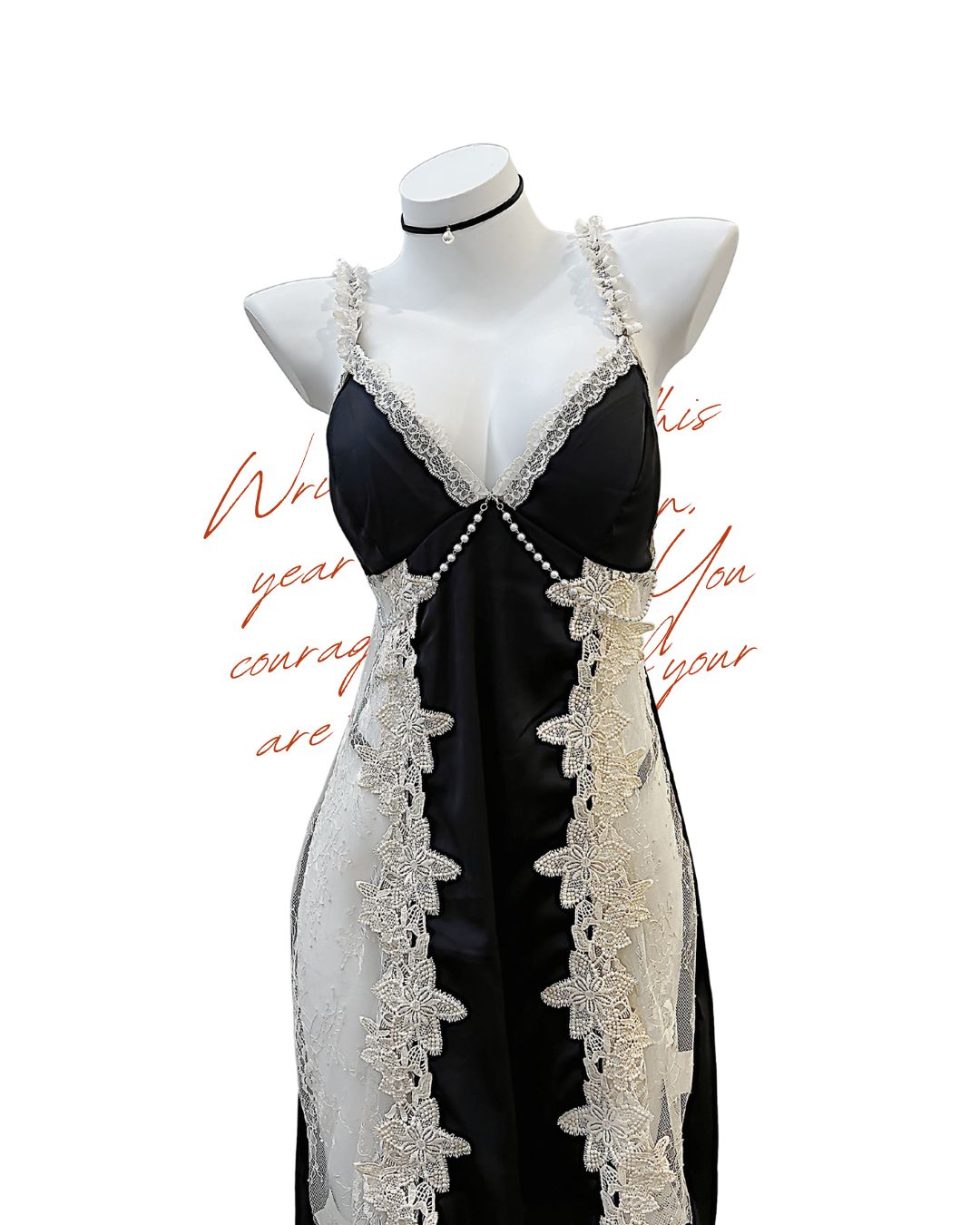 Black dress with white lace details on a mannequin against a white background