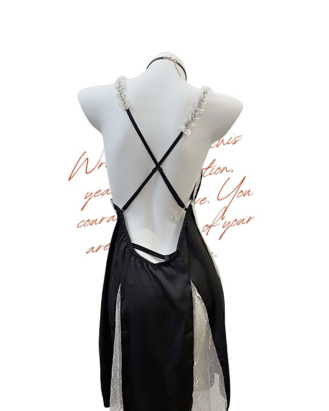 Black strappy dress on a mannequin with a white background
