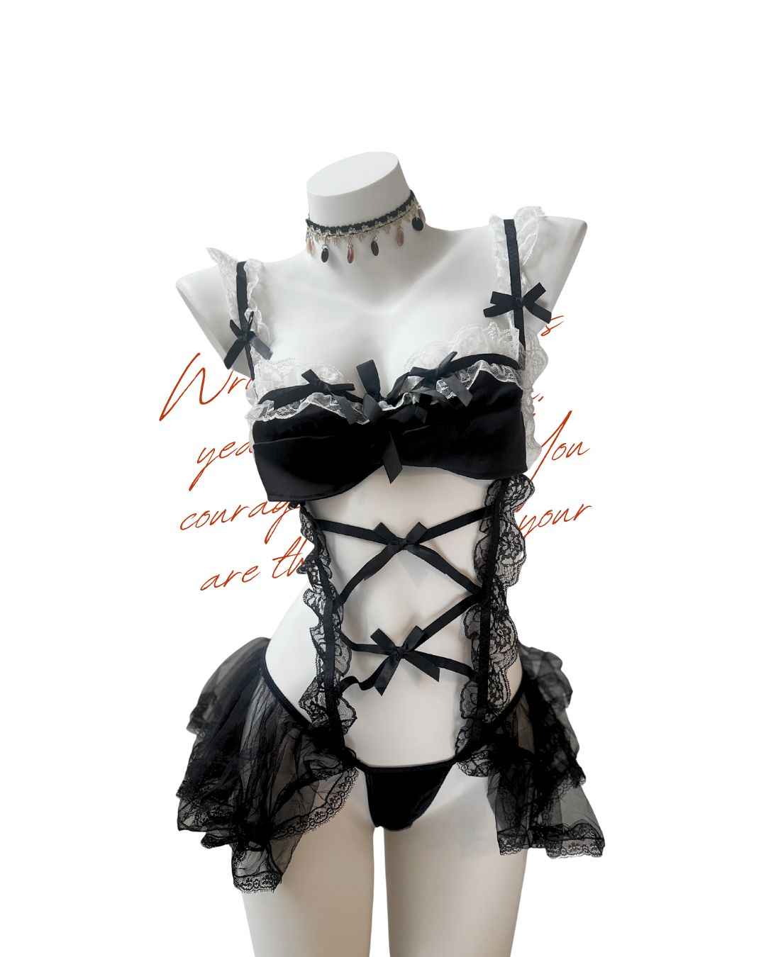 Black lace lingerie set on a mannequin with a white background