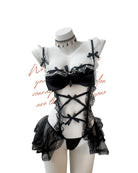 Black lace lingerie set on a mannequin with a white background