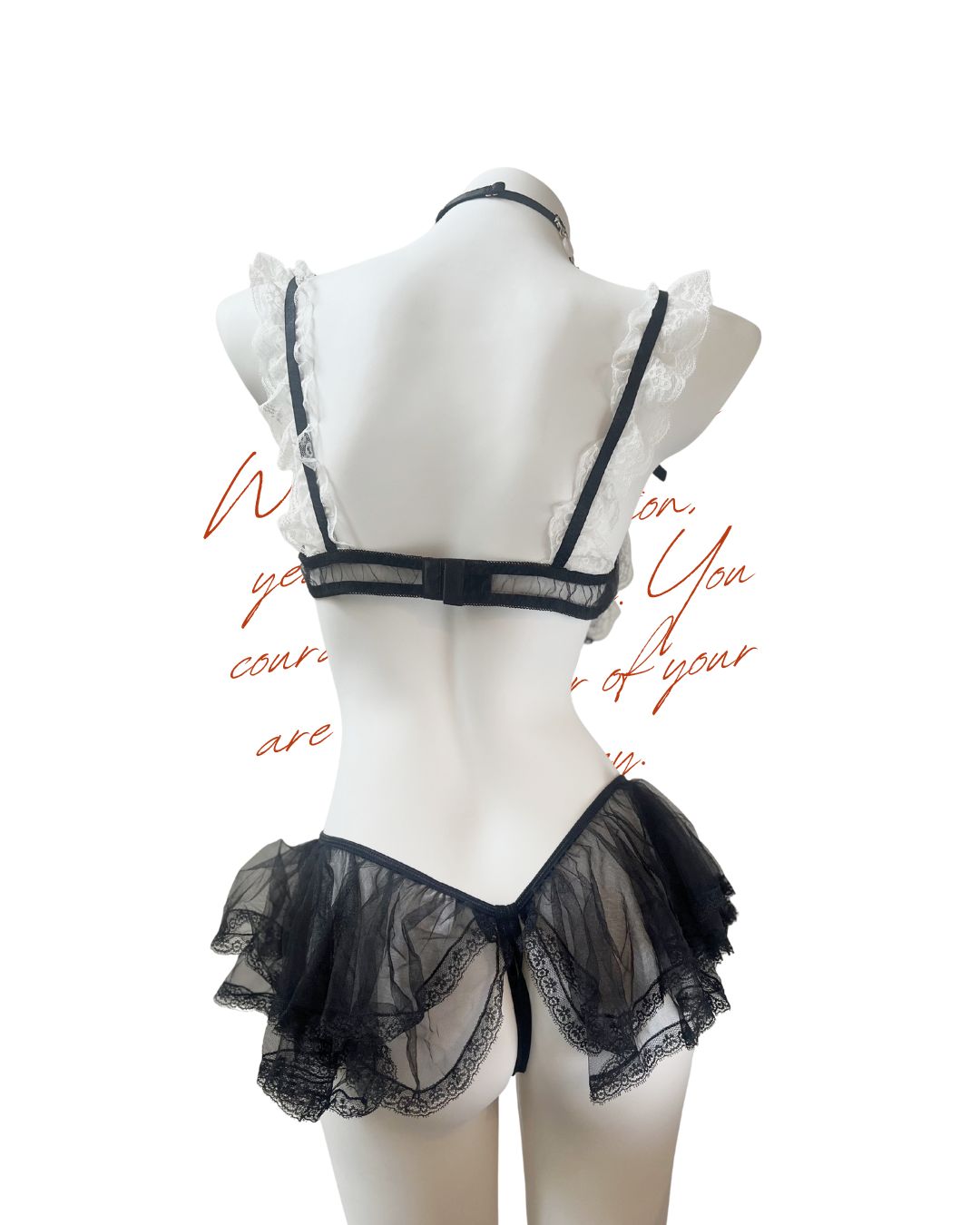 Black lace lingerie set on a mannequin against a white background