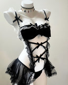 Black lace lingerie set on a mannequin against a white background