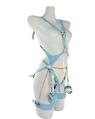 Pastel blue adjustable vegan-leather harness lingerie with gold chain details, soft cuffs, side view highlighting strap fit and silhouette.