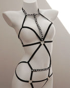 Black strappy bondage harness lingerie  with bead details on a mannequin against a neutral background
