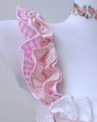 Close-up of pink satin maid dress with lace trim and gingham details, FairyBerry lingerie collection