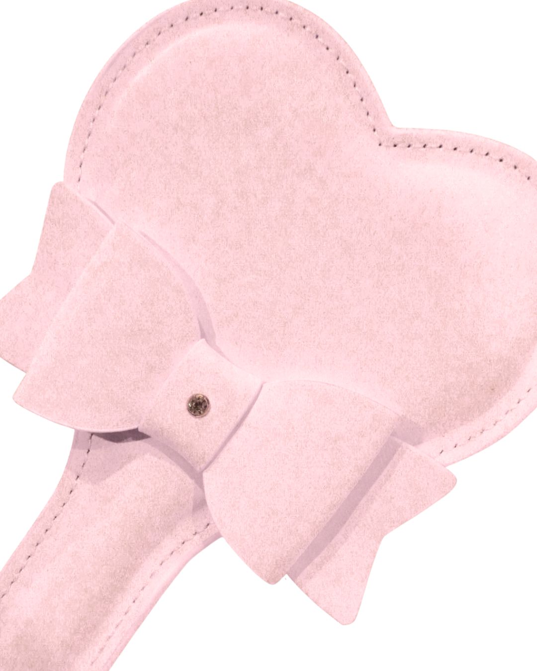 a close-view of a Blush pink heart spanking paddle