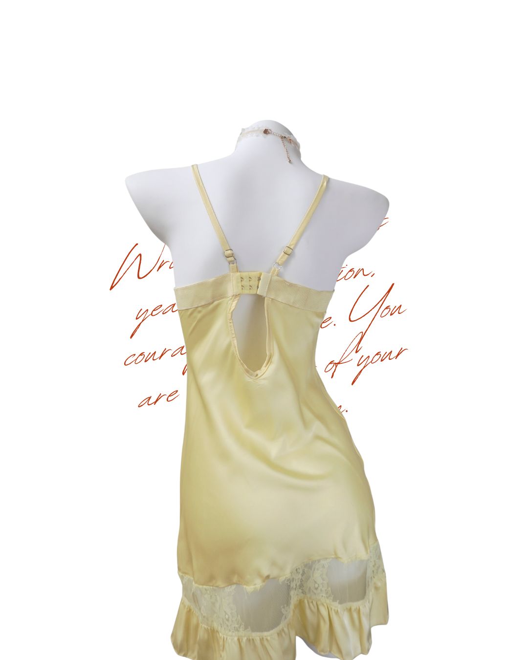 Yellow satin nightgown on a mannequin with a white background