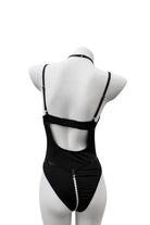 back view of Moonlock Bodysuit showing curve-hugging silhouette and soft matte stretch fabric. Modern and bold styling.