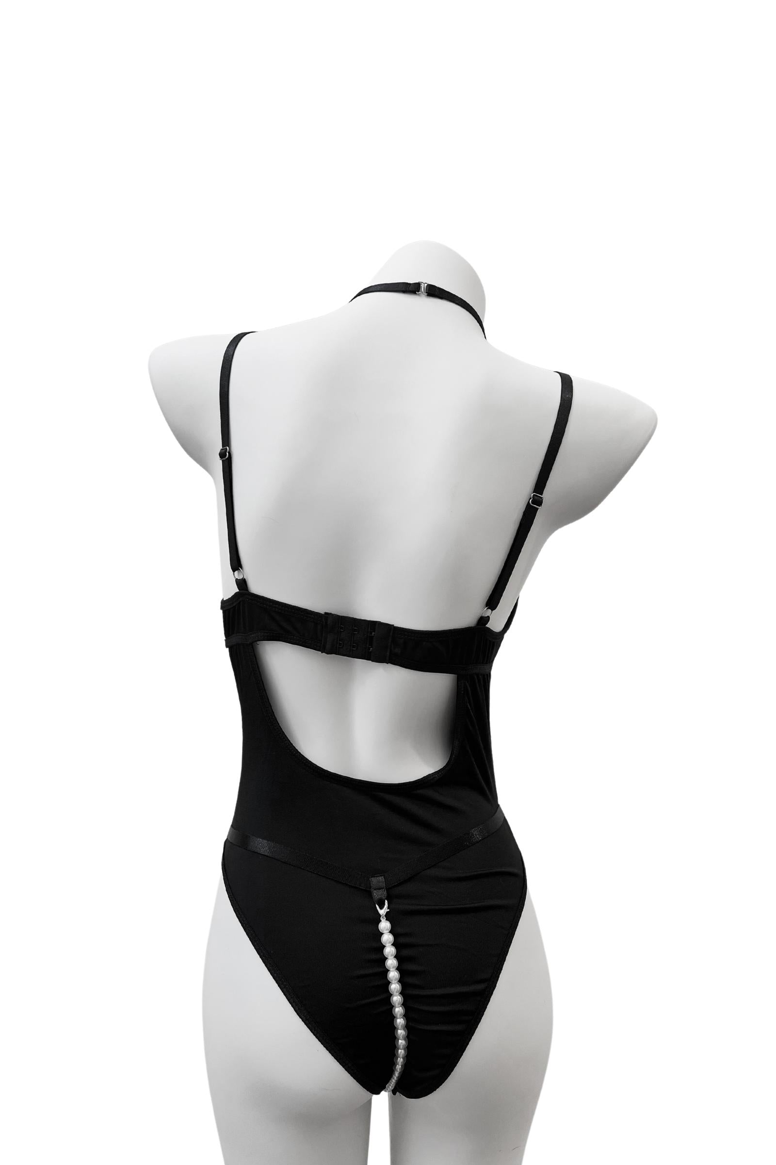 back view of Moonlock Bodysuit showing curve-hugging silhouette and soft matte stretch fabric. Modern and bold styling.