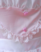 Close-up of pink heart-shaped button on Blush Sugarmaid nightdress, satin and lace detail shot