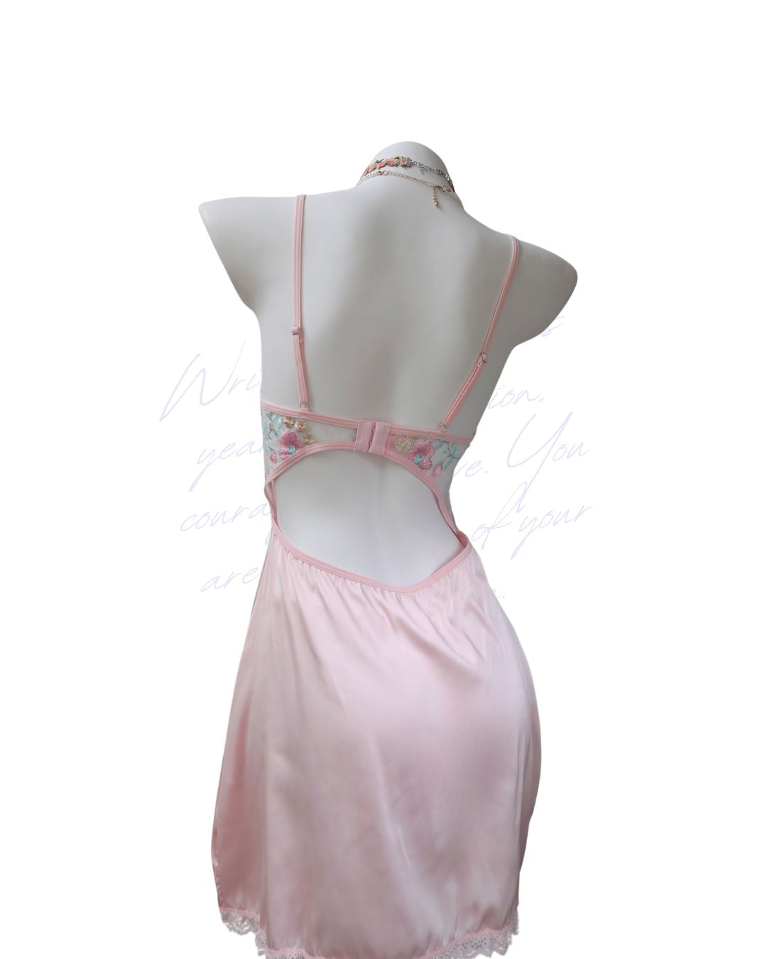 Pink nightgown on a mannequin against a white background