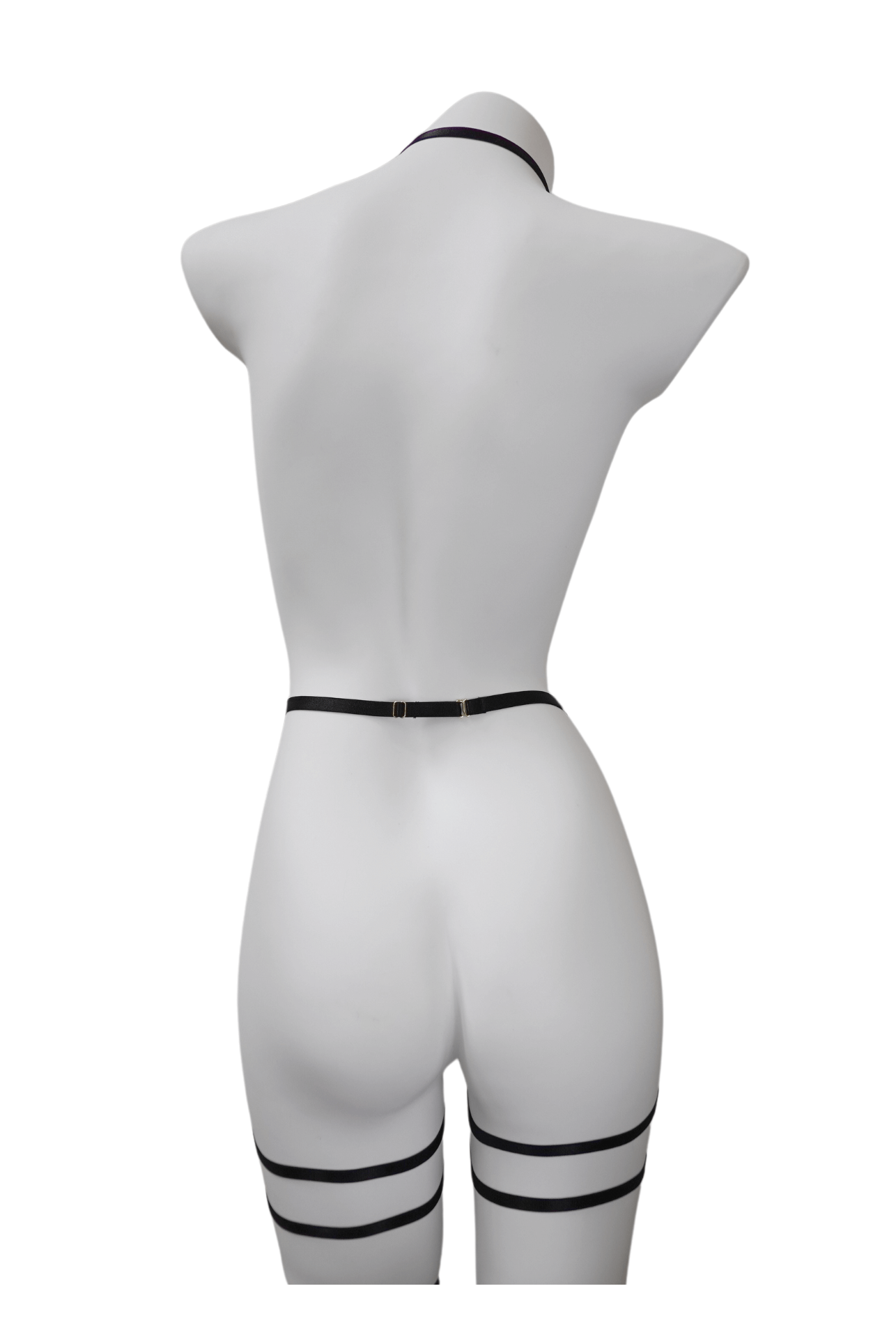 Back view of black strappy lingerie harness showing adjustable elastic fit and clean lines – soft bondage look