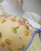 Embroidered bra with floral patterns on a mannequin