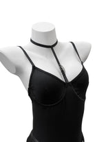 Close-up of the Moonlock Bodysuit’s silver metal ring connecting the bust and choker strap. Edgy and elegant design feature