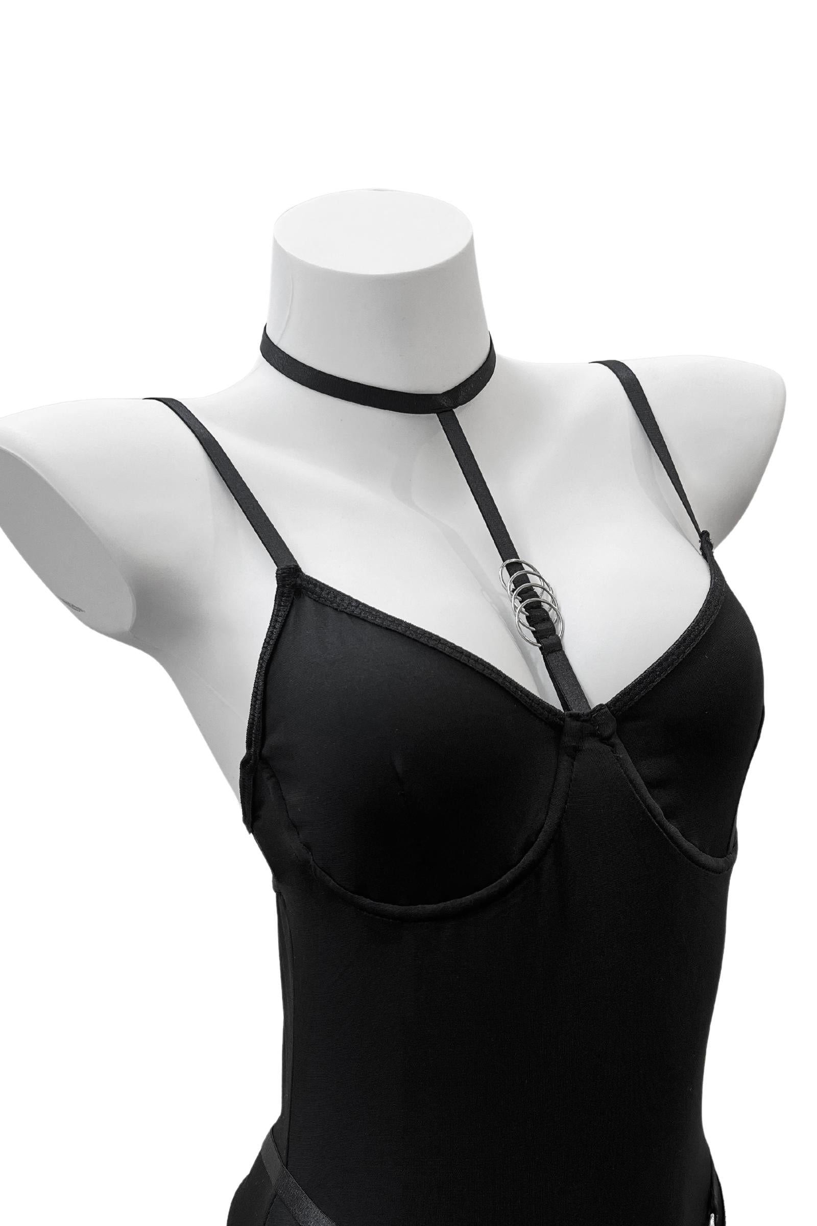 Close-up of the Moonlock Bodysuit’s silver metal ring connecting the bust and choker strap. Edgy and elegant design feature