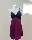 Purple nightgown with lace details on a mannequin against a plain background