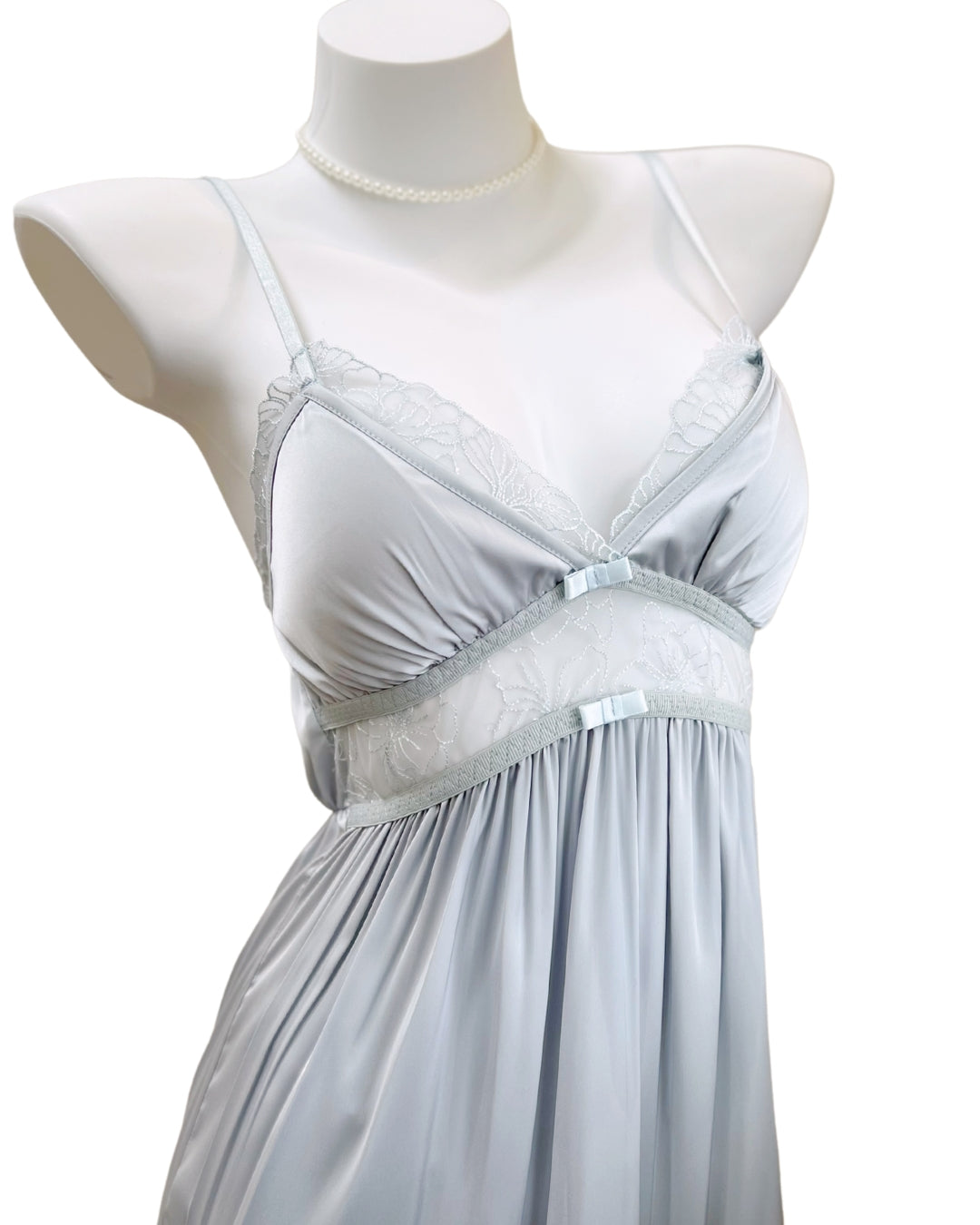 Close-up of Mistveil Babydoll showing delicate floral lace cups and soft gathers under the bust. Elegant and romantic details.