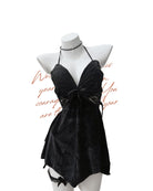 Black velvet  nightdress on a mannequin against a white background.