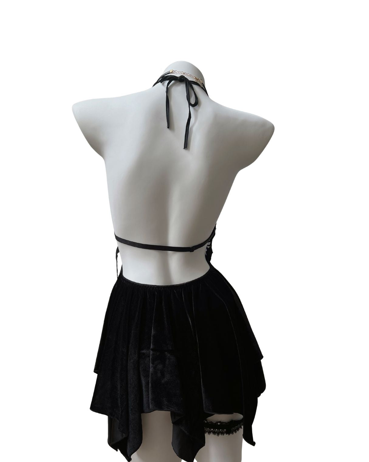 Black velvet mini dress on a mannequin against a white background