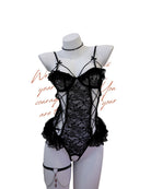 Black lace lingerie set on a mannequin with decorative text on a white background