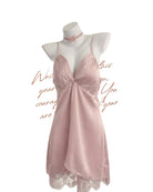 Pink satin nightgown on a mannequin with lace details against a white background
