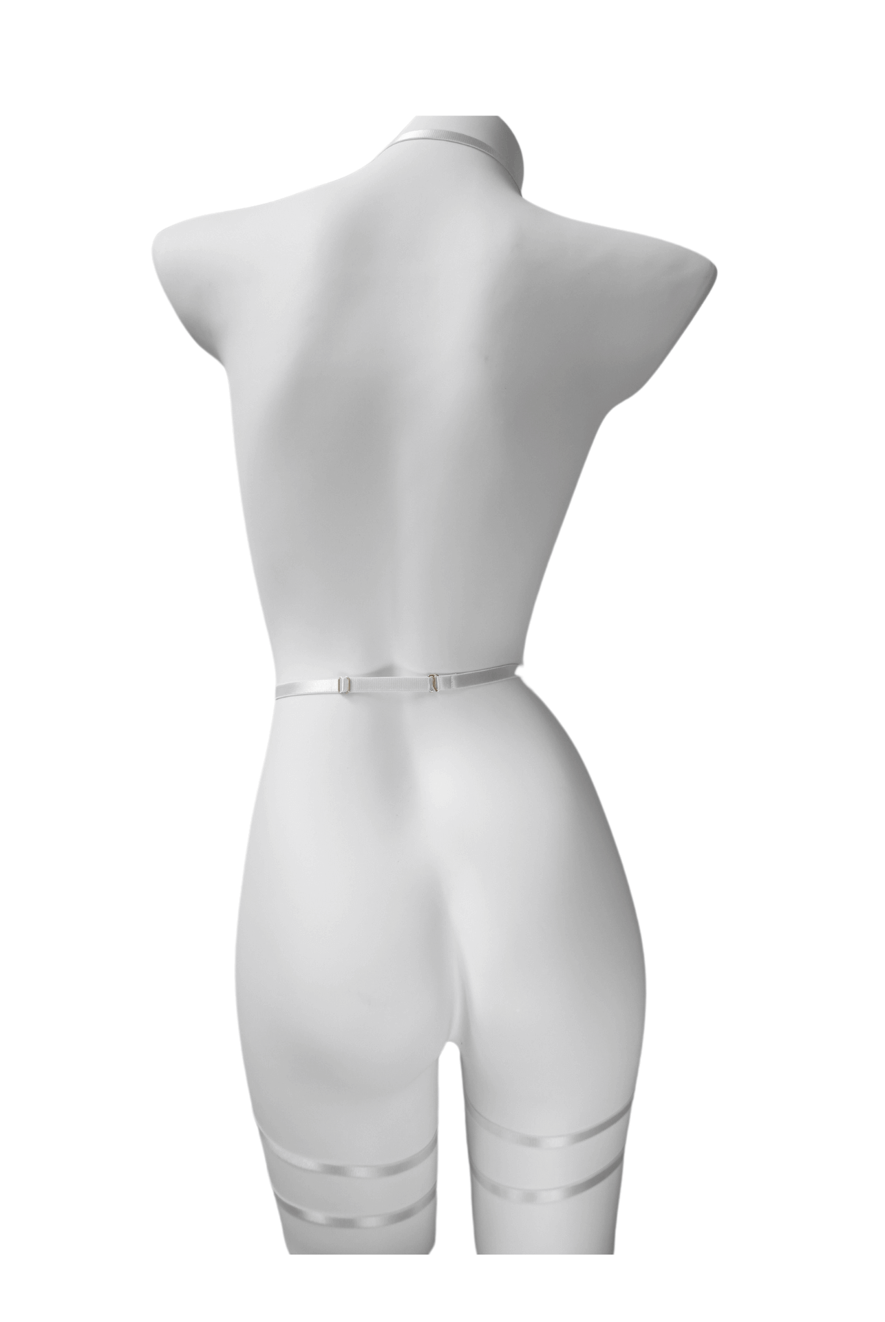 Back view of black strappy lingerie harness showing adjustable elastic fit and clean lines – soft bondage look