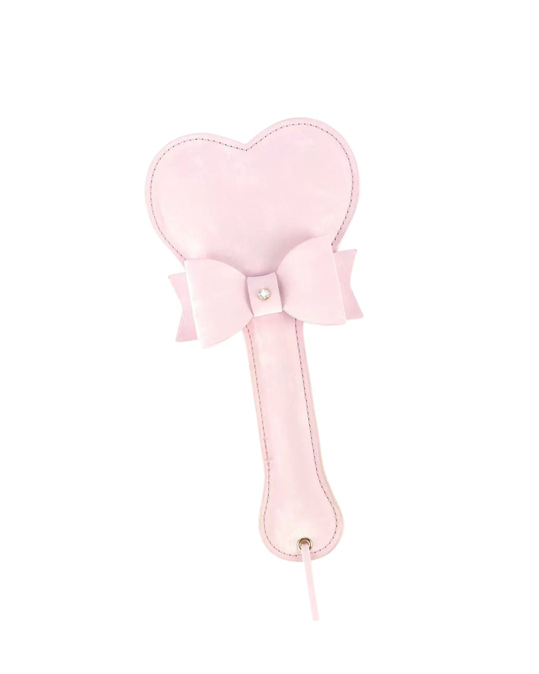 Pink heart-shaped paddle with a bow and crystal detail on a white backgroud