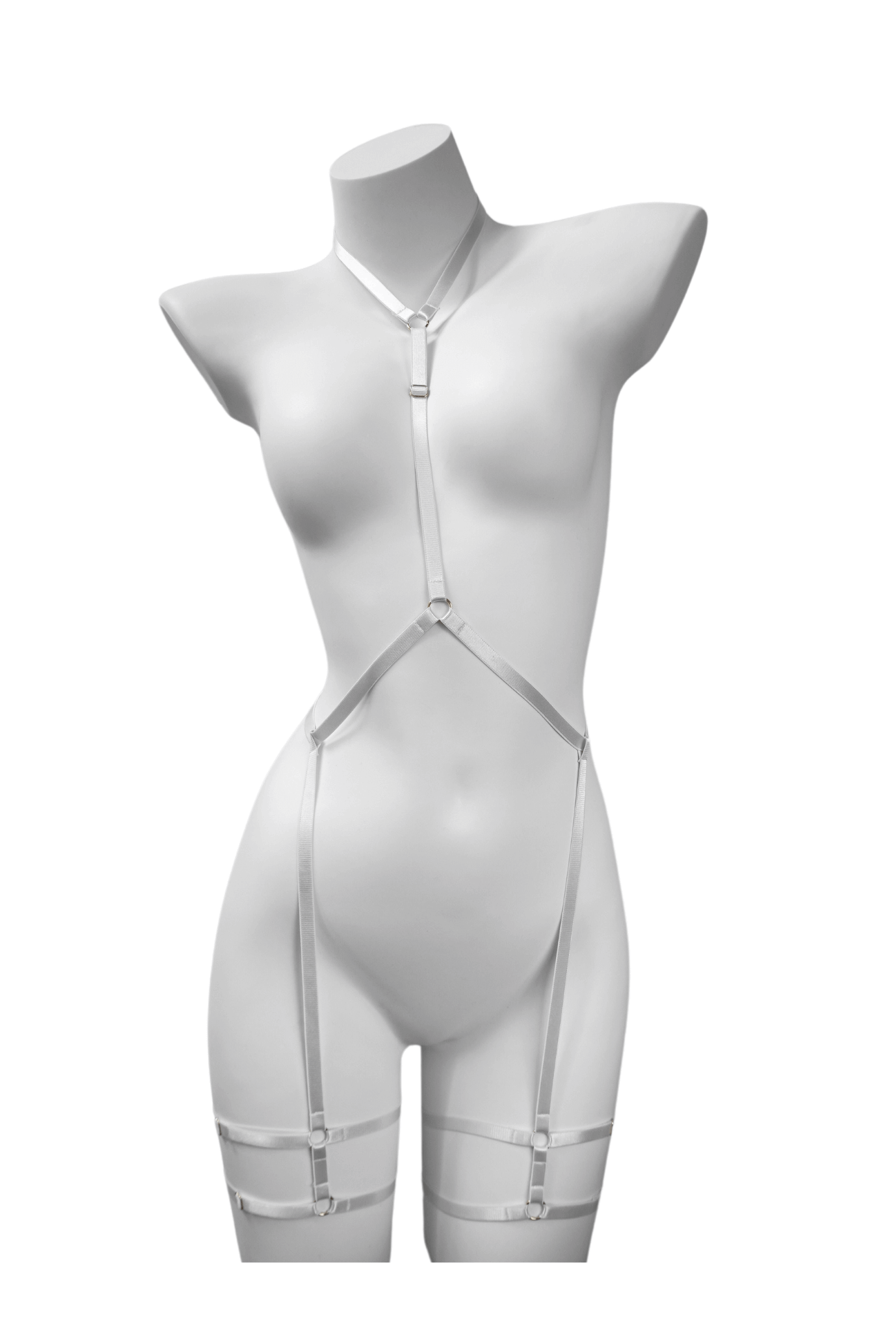 Minimalist white body harness with elastic neck, waist, and thigh straps – displayed on mannequin with silver ring accents